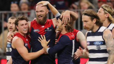 Max Gawn celebrates with teammates.