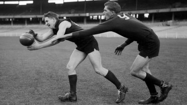 Melbourneâ€™s â€˜Hassaâ€™ Mann gets to the ball in front of his cousin, ruckman Lenn Mann, at training prior to the 1960 VFL grand final.