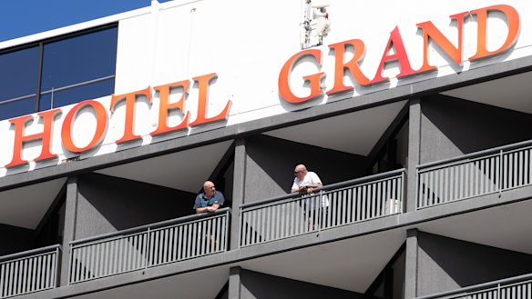 Returned travellers in hotel quarantine on Wednesday chat before being moved.