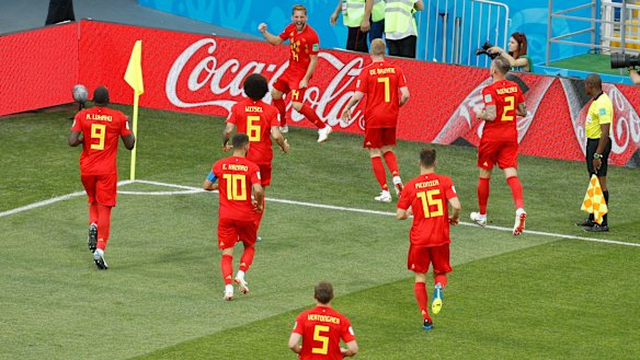 Belgium's Dries Mertens, top, celebrates after scoring the opening goal against Panama.