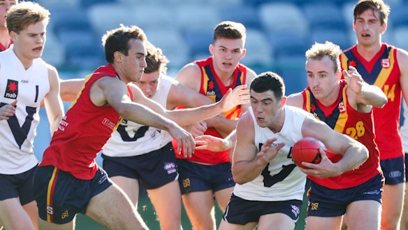 Sam Flanders bursts from a pack for Victoria Country this year.