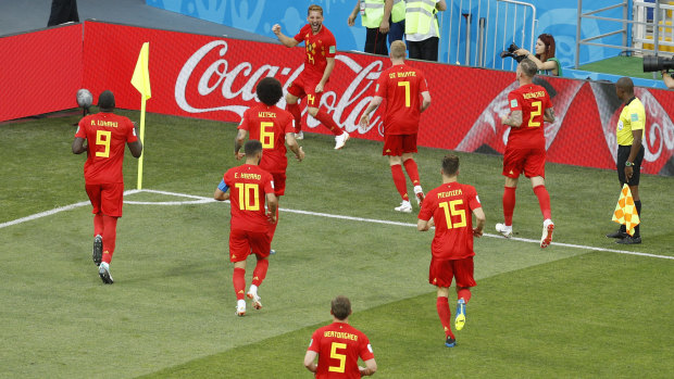 Belgium's Dries Mertens, top, celebrates after scoring the opening goal against Panama.