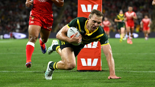 Welcome back: Tom Trbojevic scores for the Kangaroos.