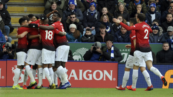 Manchester United's players celebrate Marcus Rashford's goal again Leicester at the King Power Stadium in Leicester on Sunday.