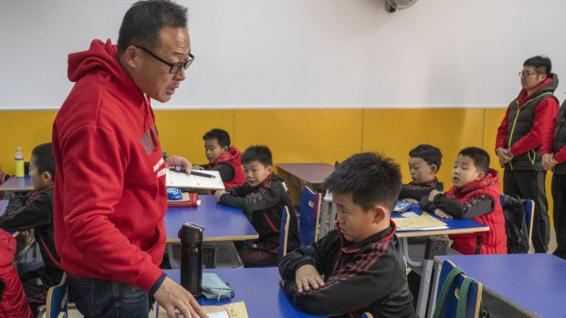 Tang Haiyan, founder of the Real Boys Club, lectures a student. "We will never cultivate sissies," he says.