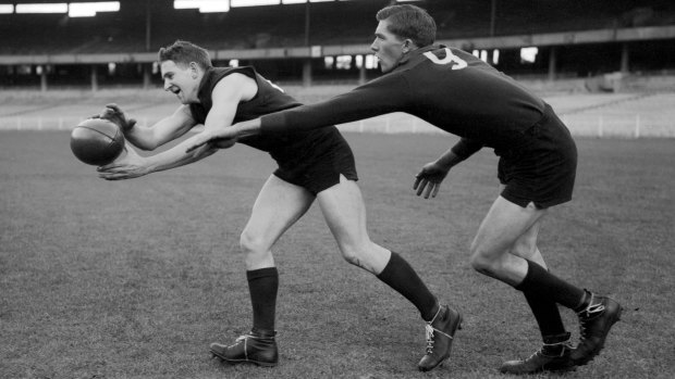 Melbourne’s ‘Hassa’ Mann gets to the ball in front of his cousin, ruckman Lenn Mann, at training prior to the 1960 VFL grand final.