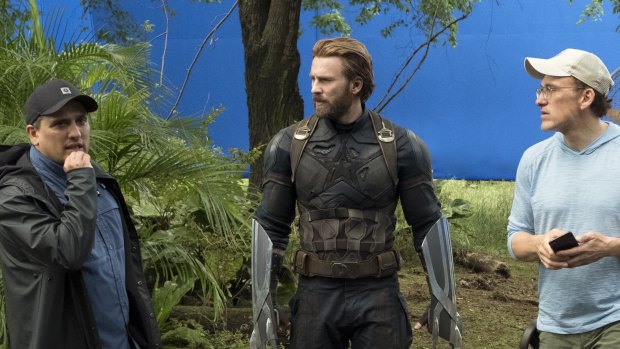 Director Joe Russo (left), Captain America/Steve Rogers (Chris Evans) and director Anthony Russo on the set of Avengers: Infinity War. 