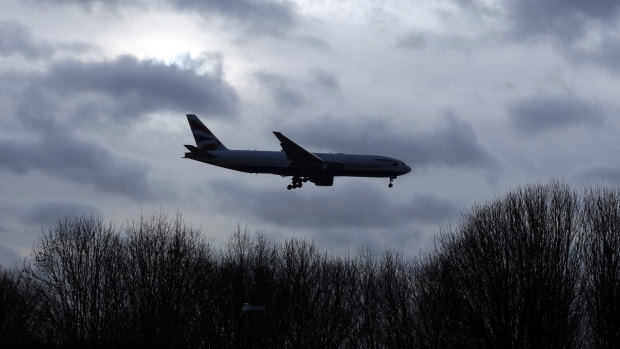 A plane comes in to land at Gatwick Airport in England.