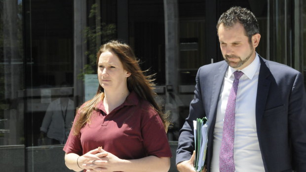 Tessa Woodcock, who kidnapped her son Phoenix Mapham in August causing a week-long search, leaves the ACT Magistrates Court with her lawyer Adrian McKenna after receiving bail.