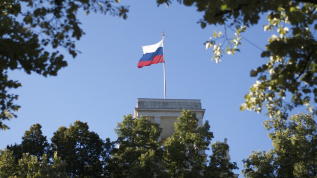 The Russian national flag waves on top of the Russian embassy in Berlin, Germany. A Briton working at the nearby British embassy was arrested on Tuesday accused of passing on secrets to Russia.