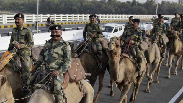 Border Security Force soldiers marching on the route that US President Donald Trump would later take. 