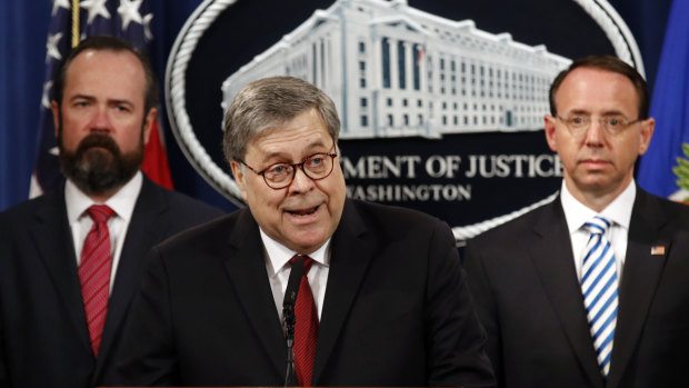 Attorney General William Barr speaks alongside Deputy Attorney General Rod Rosenstein about the release of a redacted version of special counsel Robert Mueller's report during a news conference.