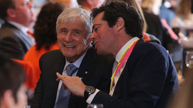 Kerry Stokes and AFL CEO Gillion McLachlan at the 2019 AFL Grand Final function at the MCG. The cancellation of live sports has bitten into Seven's advertising revenue.