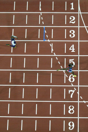 American runner Michael Johnson takes the last step before Olympic gold in the men's 400m final at Stadium Australia. 