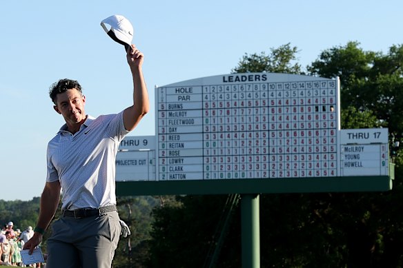 Rory McIlroy salutes the crowd at the 18th after completing a second-round 65 at Augusta.