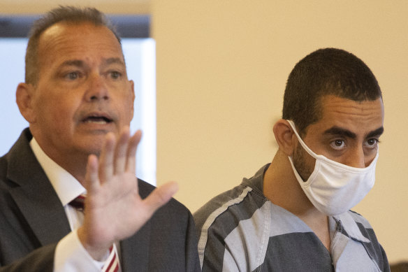 Hadi Matar, 24, (right) listens as defence attorney Nathaniel Barone speaks in court.