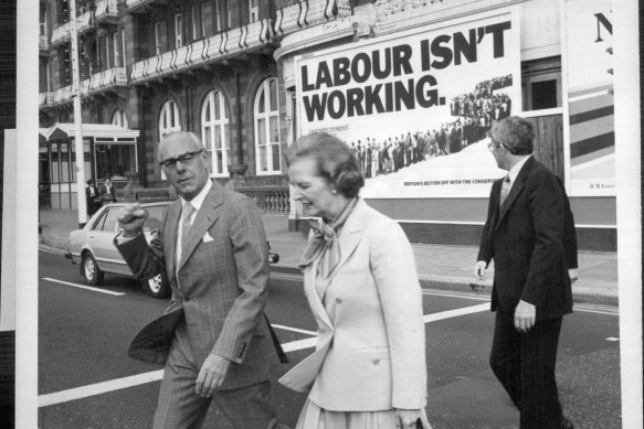 Margaret and Denis Thatcher with Saatchi & Saatchi's iconic 'Labour isn't working' campaign billboard. 