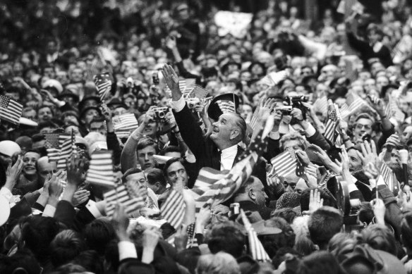 Lyndon Johnson amongst adoring crowds in Swanston Street.