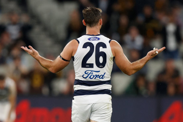 Tom Hawkins holds his arms out after giving away a 50-metre penalty.