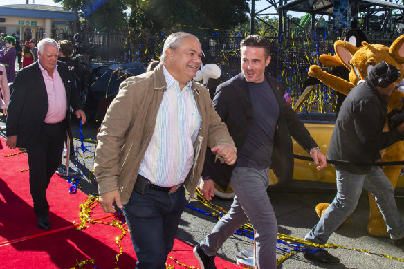 Gold Coast Mayor Tom Tate (left) at the reopening of Warner Bros Movie World Theme Park following pandemic lockdowns in 2020.