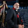 Essendon great, Michael Long poses for a photo in front of a new statue of him unveiled at the Essendon Football Club on July 17, 2018 in Melbourne, Australia. 
