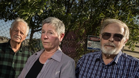 Residents Geoff Mitchelmore, Carmen Largaiolli and Bert Boere outside the site of the proposed soil cleaning plant in Brooklyn.