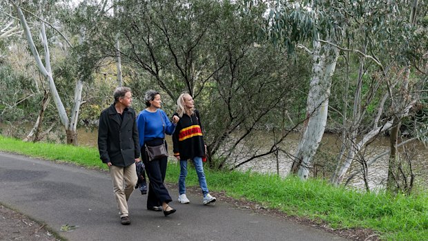 Chris Chesterfield, Nichola Lefroy and Charley Woolmore walking along the Yarra River main trail in Abbotsford.