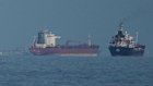 Oil tankers and cargo ships line up in the Strait of Hormuz as seen from Mina Al Fajer, United Arab Emirates, Wednesday, March 11, 2026. (AP Photo/Altaf Qadri)
