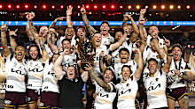 The Broncos lift the Provan-Summons Trophy. 