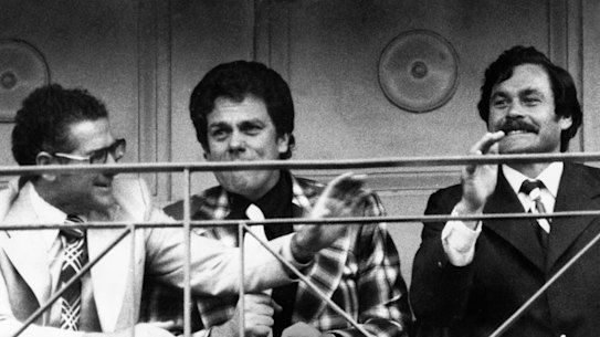 North Melbourne officials Bill Stephen (left), Max Ritchie and Barassi watch the final minutes of the Kangaroos’ victory in the 1975 VFL grand final.