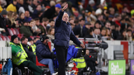 Socceroos coach Graham Arnold talks to his team from the sideline in Melbourne.