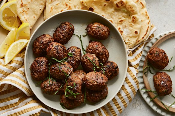 Beef koftas with pita bread and minted yoghurt.