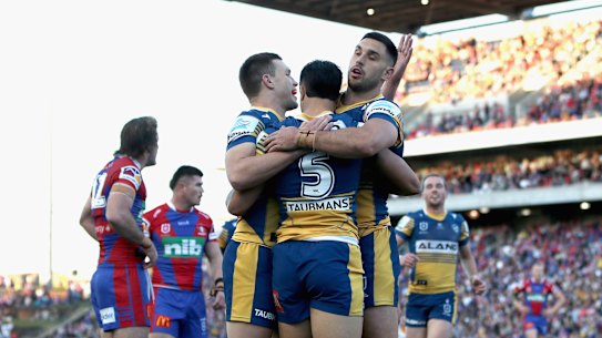 The Eels celebrate Haze Dunster’s try during the big win over Newcastle.