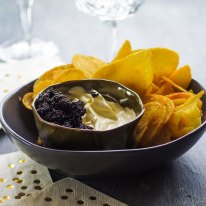 Kettle chips with champagne creme fraiche and caviar. Christmas canape recipes for Good Food online feature December 2018. Please credit Katrina Meynink.