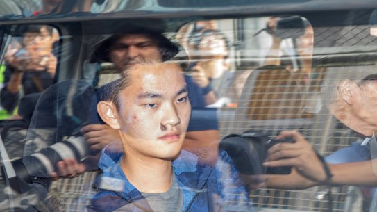 Murder suspect Chan Tong-kai inside a vehicle leaving Pik Uk Prison in Hong Kong.