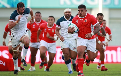Siegfried Fisiihoi runs the ball for Tonga on Sunday.