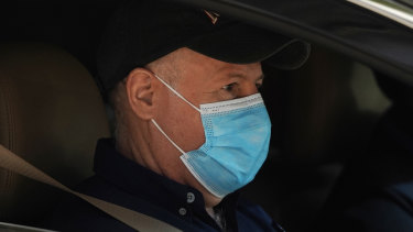 Dr Peter Daszak of the World Health Organisation team sits in a car on his way to a field visit in Wuhan in central China’s Hubei province. 