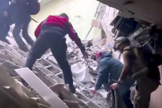 This f<em></em>rame taken from an undated video provided Sunday, May 1, 2022 by the Azov Special Forces Regiment of the Ukrainian Natio<em></em>nal Guard shows people climbing over debris at the Azovstal steel plant, in Mariupol.