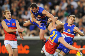 Brad Johnson crashes into Daniel Merrett.