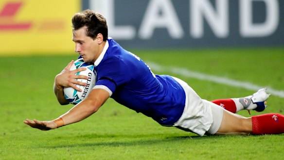 France's replacement halfback Baptiste Serin stops the rot with a try.