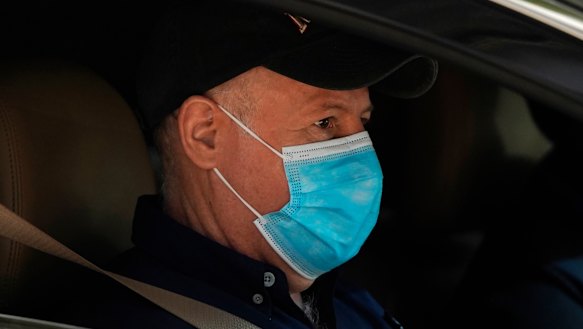 Dr Peter Daszak of the World Health Organisation team sits in a car on his way to a field visit in Wuhan in central China’s Hubei province. 