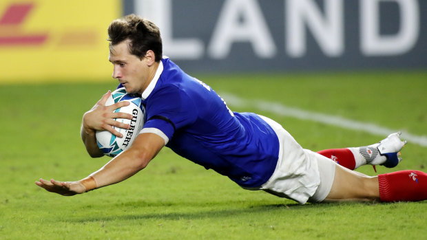 France's replacement halfback Baptiste Serin stops the rot with a try.