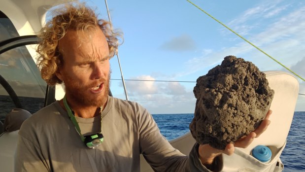 Mick Hoult with a sample of the pumice he encountered sailing to Fiji.
