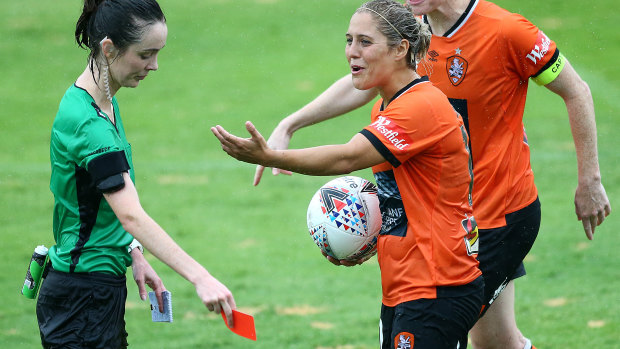 Early shower: Brisbane's Katrina Gorry reacts after being given a red card for her second bookable offence.