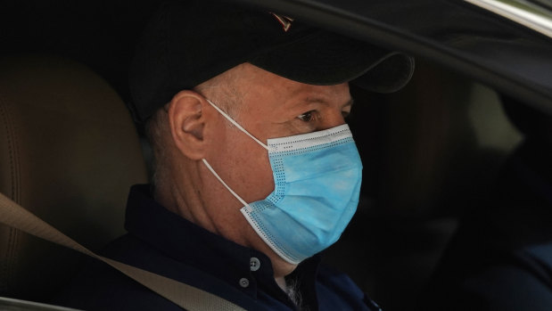 Dr Peter Daszak of the World Health Organisation team sits in a car on his way to a field visit in Wuhan in central China’s Hubei province. 