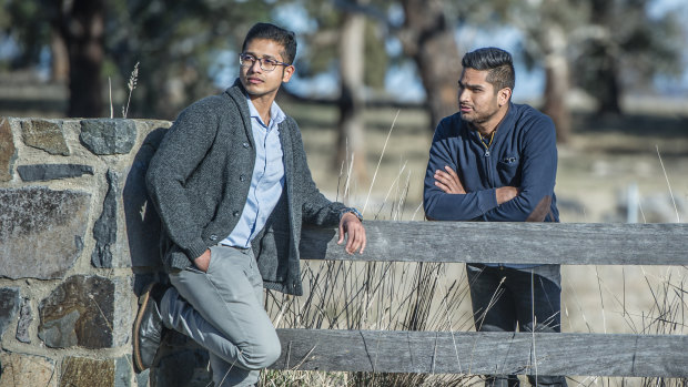 Chandan Paul, left, of Bangladesh and Yatin Malik of India and other prospective migrants have had their hopes of permanent residency in Australia dashed by ACT changes to visa rules. 