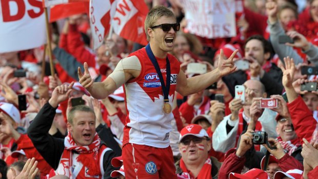 Kieren Jack laps up the glory after Sydney's 2012 AFL grand final win.