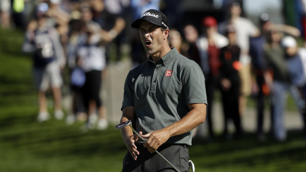 Adam Scott shows his frustration as a birdie putt just misses on the second hole.