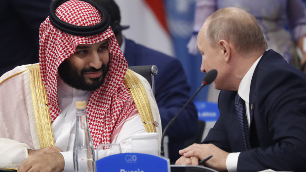 Crown Prince Mohammed bin Salman talks with Russia President Vladimir Putin during a G20 session.