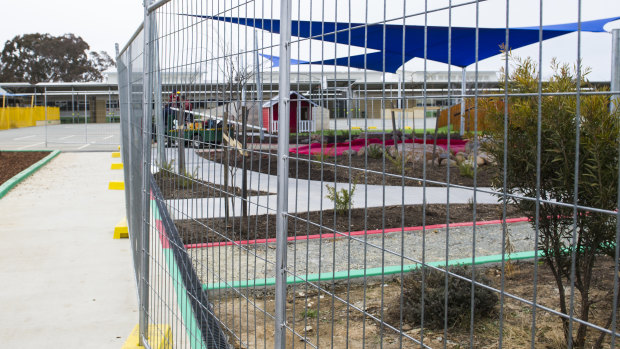 Temporary fencing was erected around garden beds in the preschool area at Harrison School on Thursday. It is unclear whether this is one of the areas that contains non-friable asbestos.